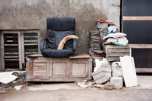 Close-up of a gardener preparing equipment for garden clearance in Poplar